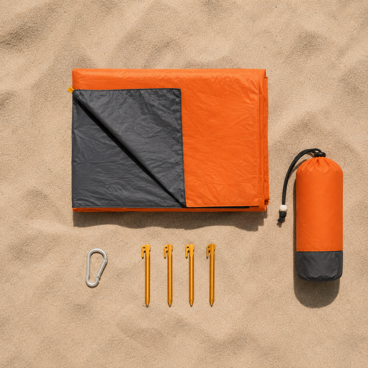 "SandFree beach blanket folded into compact carry size"