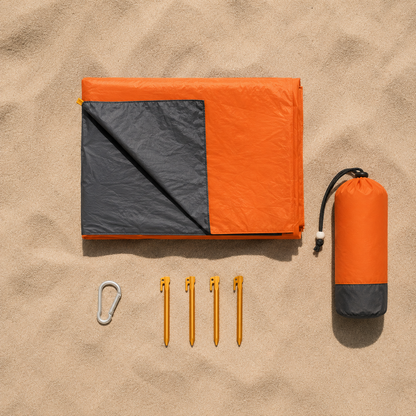 "SandFree beach blanket folded into compact carry size"